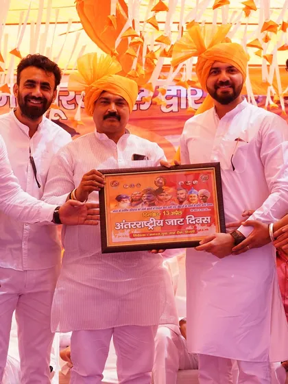 Another moment of felicitation at the community gathering in Delhi.