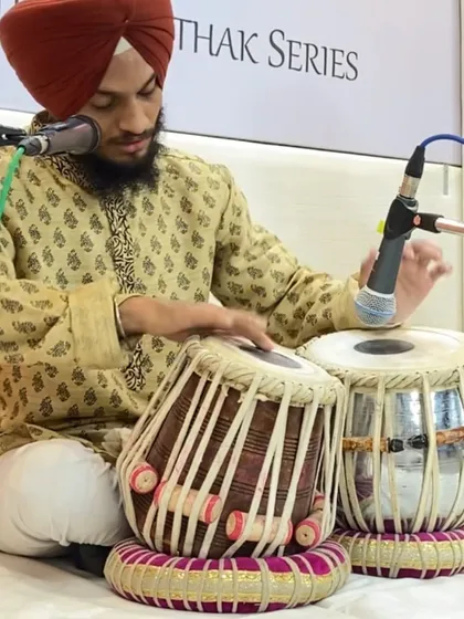 A close-up of my hands during a performance, showing the intricate fingerwork required for classical tabla.