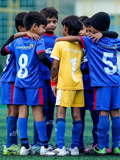 We are more than just a team; we are a family. A pre-game huddle with our U9 Young Blues Elite squad captures the spirit of unity, teamwork, and mutual support that we instill in our players from day one.
