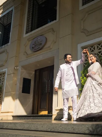 A dance, a twirl, a moment of pure happiness on the steps of a classic building. Rajat and Rachita's joy is radiant.