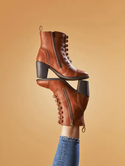 Kicking away the work blues. This was a fun, creative shot for Pepitoes Footwear. Using a model's leg to create this balanced composition adds a playful and dynamic element to a standard product shot.