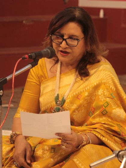 An artist reading lyrics before her performance, ensuring a heartfelt and accurate rendition.