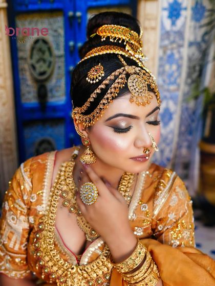 A close-up portrait that focuses on the delicate expression and the perfectly applied makeup, from the eyeshadow to the lip color.