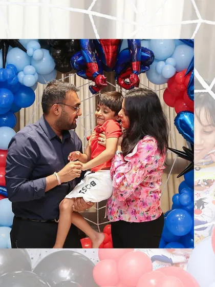 Capturing the happy family moments is what it's all about. The Spider-Man backdrop created a fun and memorable setting for their photos.