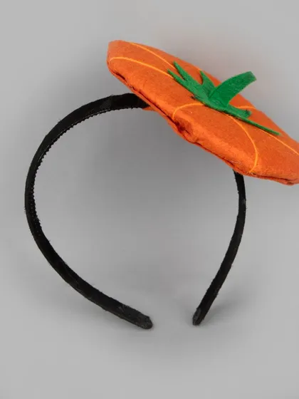 A cute pumpkin-themed Halloween headband.