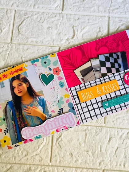 This page from a flipbook shows how I use different textures and layers, like vellum and patterned paper, to add depth and interest to your photos.