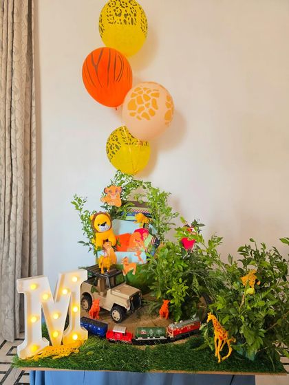 Celebrating a milestone with the glory of the Lion King. This jungle-themed hamper is bursting with color, greenery, and animal figures.