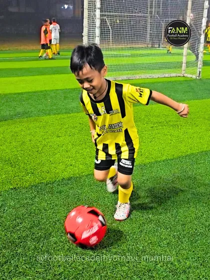 One of our youngest members enjoying his time on the pitch, developing a love for the ball.