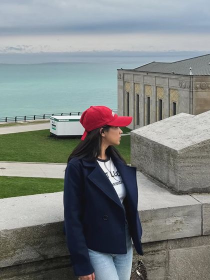 A weekend vibe shot near the water, showing a casual outfit perfect for a student's day off.