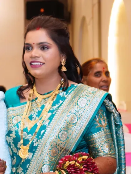 A candid shot of this beautiful reception bride. Her makeup was kept classic and elegant to complement her traditional teal saree.