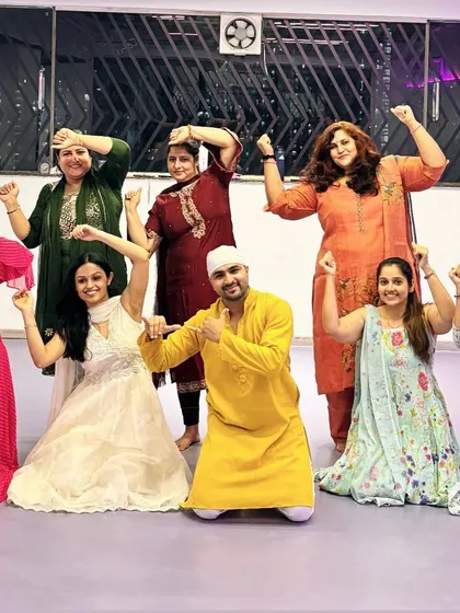 Striking a power pose with my students during our Janmashtami celebration. It's all about feeling strong and joyful together.