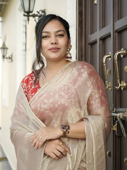A full-length shot showing how the jhumkas balance the entire traditional ensemble.