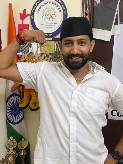 A moment at home, surrounded by the medals and trophies my athletes have won. Their success is my pride. Jai Hind!
