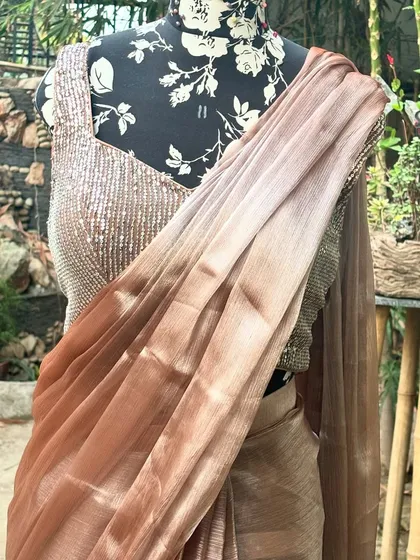 The beautiful sheen of the 'SAJEELI' saree fabric is evident in this close up shot. It’s a piece that feels as good as it looks.