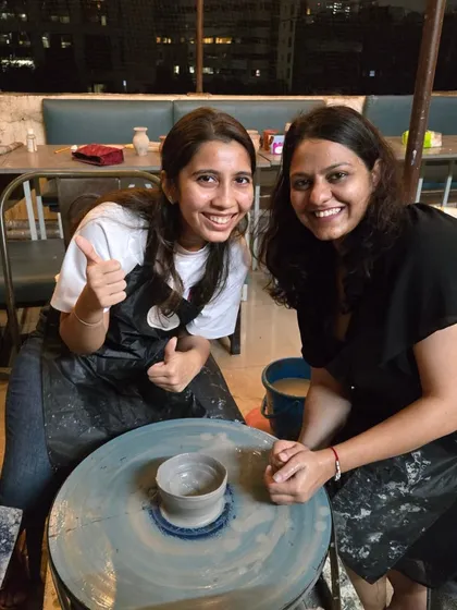 Success. A participant gives a thumbs-up, proud of the bowl she has just created on the wheel. That feeling of accomplishment is what my workshops are all about.