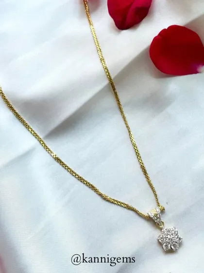 Every piece of jewellery tells a story. This delicate gold chain with a floral diamond pendant speaks of classic beauty and enduring charm, perfect for adding a touch of sparkle to life’s precious moments.