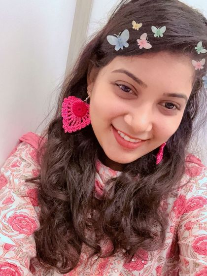 Another way to style the large heart-shaped crochet earrings. They are versatile and bring a handmade touch to any look.