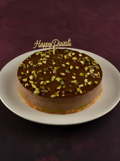 This is my Pistachio Kunafa Chocolate cake, a unique fusion dessert for Diwali. It combines the textures of crunchy kunafa and creamy chocolate pistachio mousse.