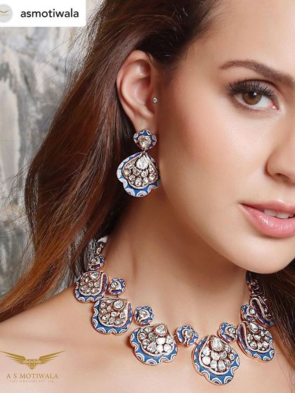 A close-up from the A S Motiwala campaign, highlighting the intricate enamel work and stunning diamonds of this peacock-inspired masterpiece.