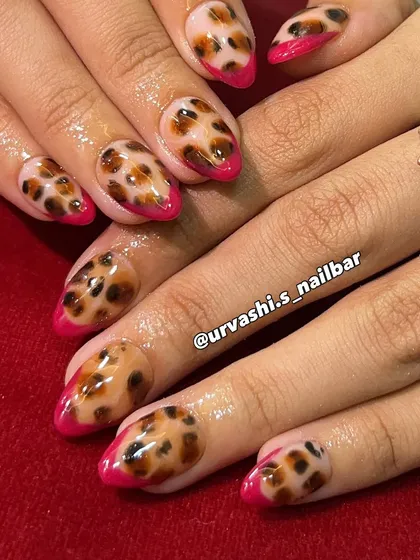 A fierce and fabulous take on a French manicure. I combined a classic leopard print with bold, hot pink tips for a look that is wild and stylish.