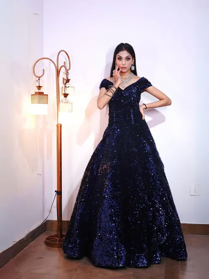 A classic portrait pose in our stunning navy blue ball gown.
