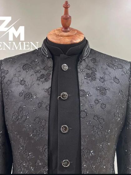 A close-up of the black tonal embroidered Indo-Western, showing the intricate floral pattern and the high-quality buttons.