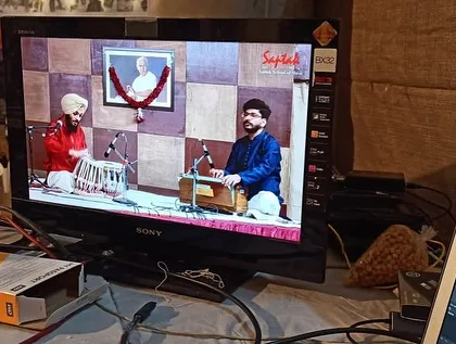 My tabla solo performance at the prestigious Saptak Music Festival in Ahmedabad, seen here on the monitor. I was accompanied by the fine artist Nilay Salvi on the harmonium.