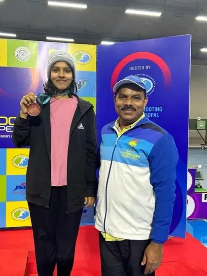 Pranavi with me after winning the bronze medal in the junior mixed event at the 66th National Championship.