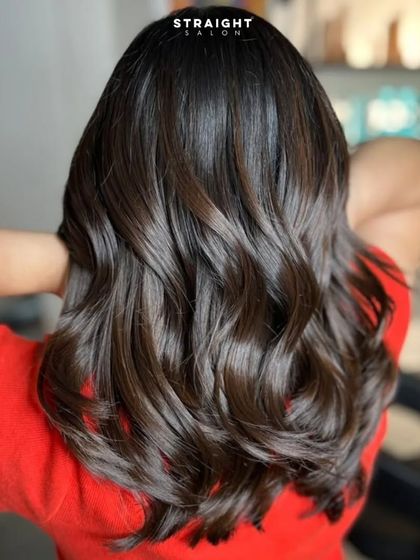 A full back view of the balayage, showcasing the volume and beautiful styling.