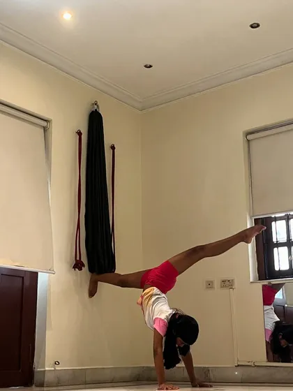 Here's a young student demonstrating incredible progress in our kids' flexibility training. This wall-assisted split handstand shows the strength and control we build in our gymnastics and flexibility programs for children in Kolkata.