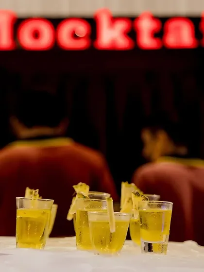 My Pineapple Twist Mocktail is a fizzy and refreshing drink, perfect for beating the heat. Served in front of our glowing 'Mocktail' sign, it promises a tropical and fun experience.
