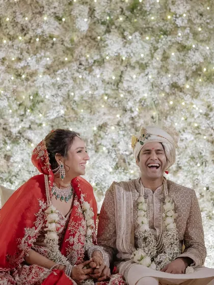 Nikunj's infectious laughter fills the frame as he and Anaaya sit together after their wedding. Capturing these moments of pure, uninhibited joy is what we do best.