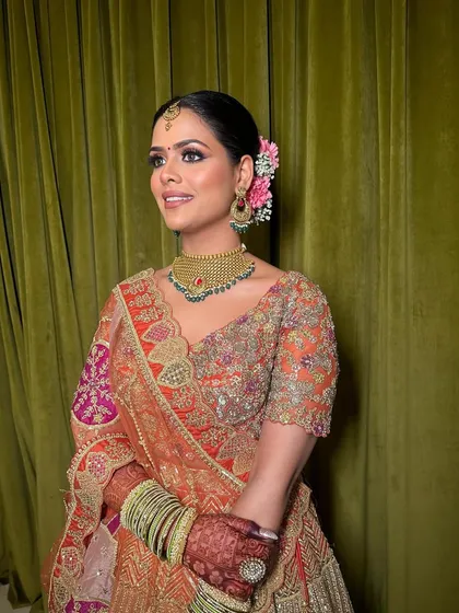 The bride's radiant smile says it all. The makeup is designed to be both beautiful and long-lasting, perfect for her special day.