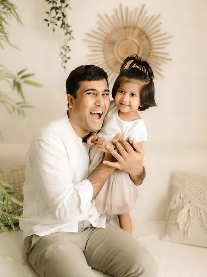 A father and daughter sharing a big, happy laugh. These are the real moments that matter.