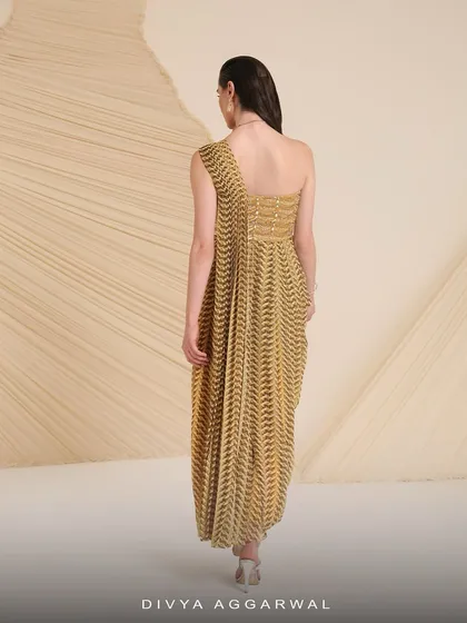 The back of the Verity co-ord set, showing the one-shoulder design of the asymmetrical blouse and the flow of the drape-style skirt.