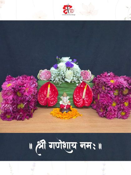 As skills develop, students take on creative challenges like this mini Ganpati floral design. This piece beautifully blends traditional elements like lotus and marigolds with modern anthuriums.