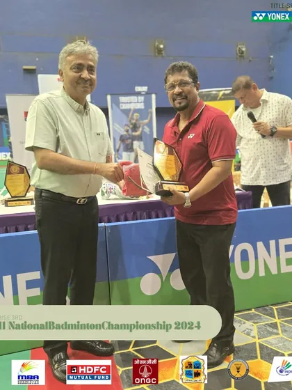 Honoring an umpire for his contribution to the tournament. Their expertise is vital for maintaining the integrity of the competition.