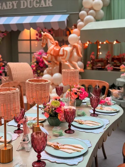 A miniature Eiffel Tower prop adds a perfect Parisian touch to the table, tying the whole theme together beautifully.