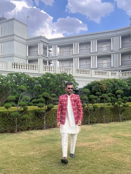 Walking with style at a beautiful outdoor venue. I always feel at home in grand wedding settings.