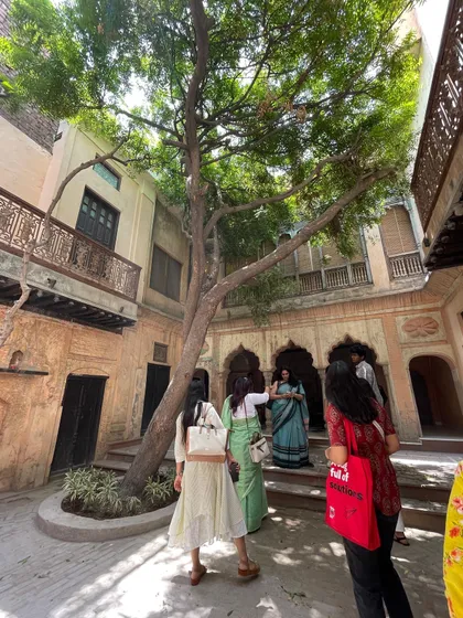 The courtyard at Kathika filled with visitors, demonstrating its success as a public cultural space that brings the community together.