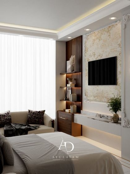 This bedroom blends traditional and modern elements, with a classic false ceiling, dark wood furniture, and a contemporary TV wall featuring a textured finish.