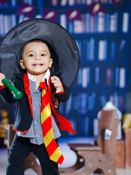 Wingardium Leviosa! We bring the magic of Hogwarts to life with our Harry Potter themed shoot. This little wizard, complete with a Gryffindor tie and wand, is ready for his adventure in our detailed library backdrop.