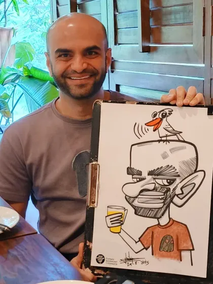 This gentleman enjoyed his caricature, which featured a little bird and a drink, capturing the relaxed brunch atmosphere perfectly.