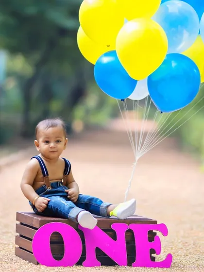 Balloons always add a pop of celebration. I use props like these to create a festive and vibrant atmosphere for first birthday portraits.