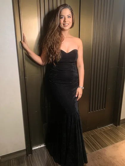 Another full-length view of the classic black gown.