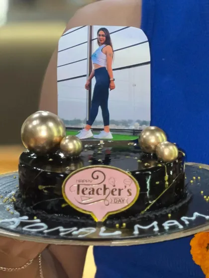 A close-up of the thoughtful Teacher's Day cake. They even put a little picture of me on it.