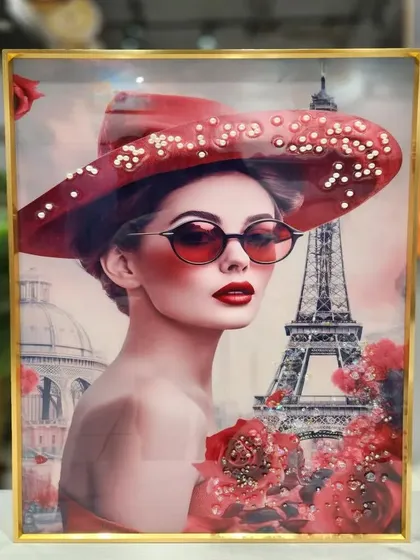 Add a touch of Parisian chic to your decor with this crystal painting of a stylish woman in a red hat. The vibrant reds and iconic Eiffel Tower background make this 16x24 inch piece a sophisticated and fashionable statement.