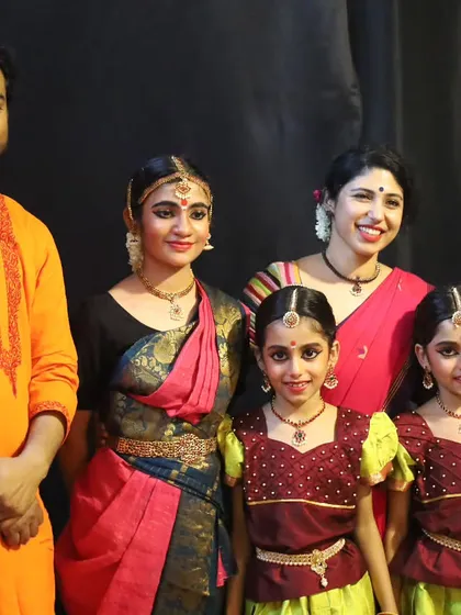 A proud moment with my students of various ages after a performance. It is wonderful to see them in full 'aharya' (costume and makeup), ready to share their hard work and artistry with an audience.