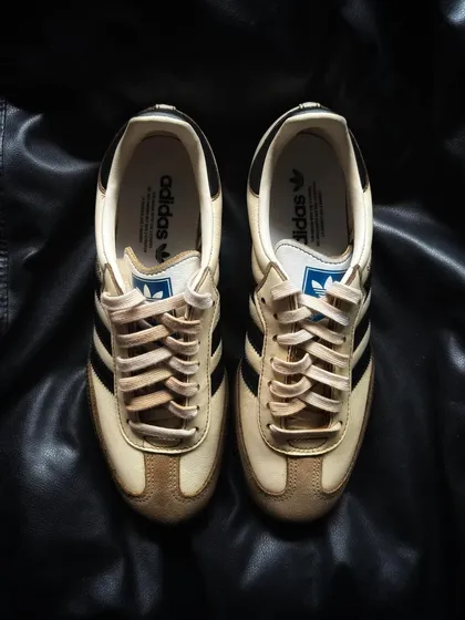 A front view of the coffee-themed Adidas Sambas.