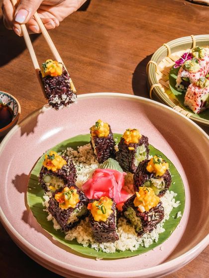 A closer look at our Purple Rice and Asparagus Sushi. This creative and healthy vegetarian sushi option is a favorite for its unique texture and fresh, vibrant taste.